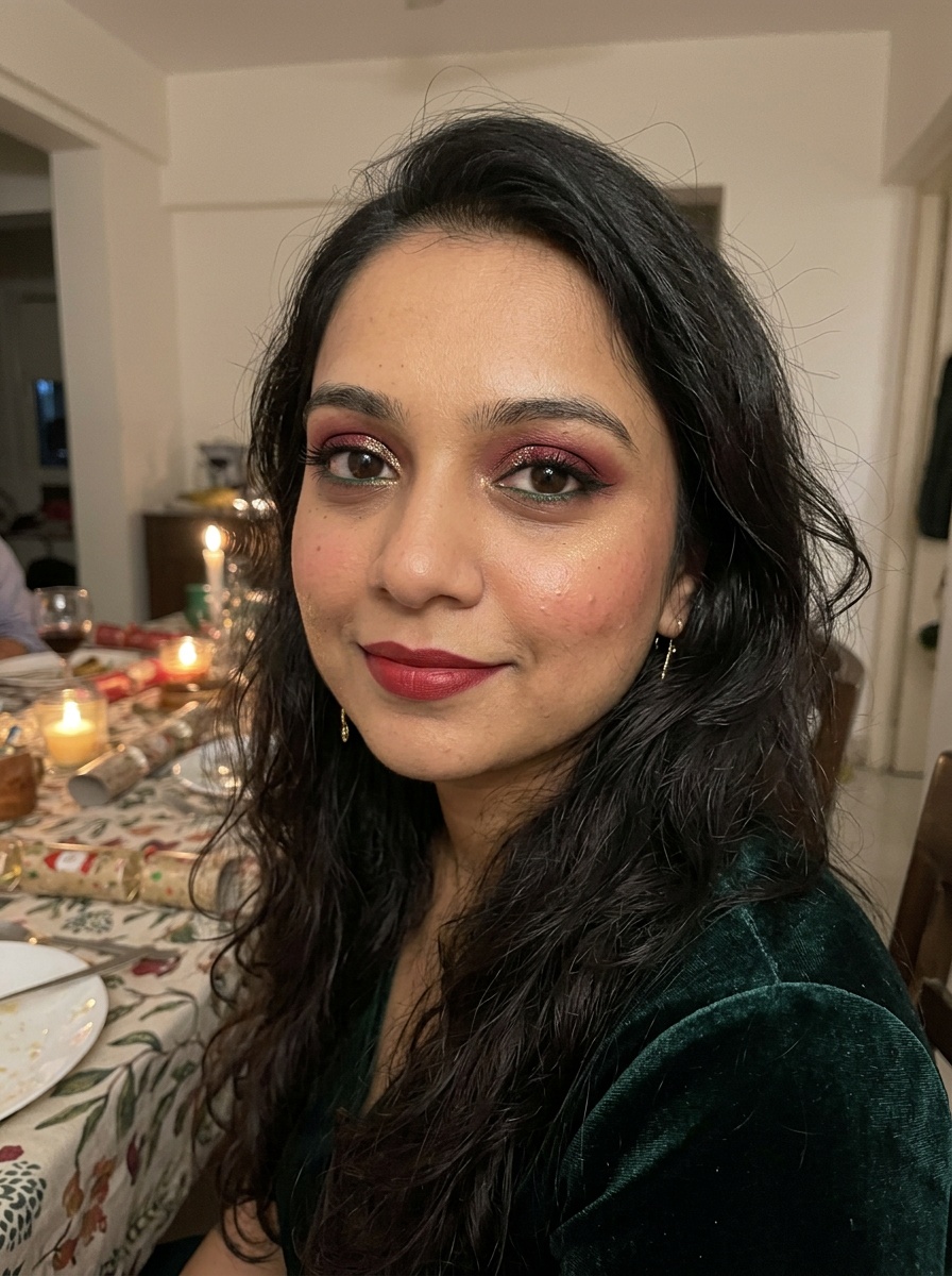 Christmas Makeup on a woman in her late 20s with medium skin, brown eyes and a round face