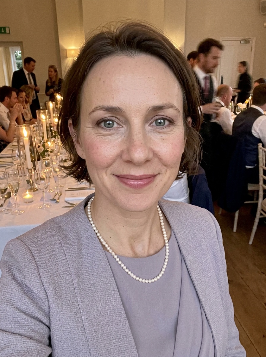Mother of the Bride Makeup on a woman in her mid 40s with light skin and deep-set blue-grey eyes