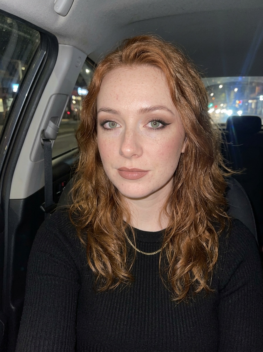 Siren Eyes on a woman in her late 20s with fair skin, red hair and hooded green eyes