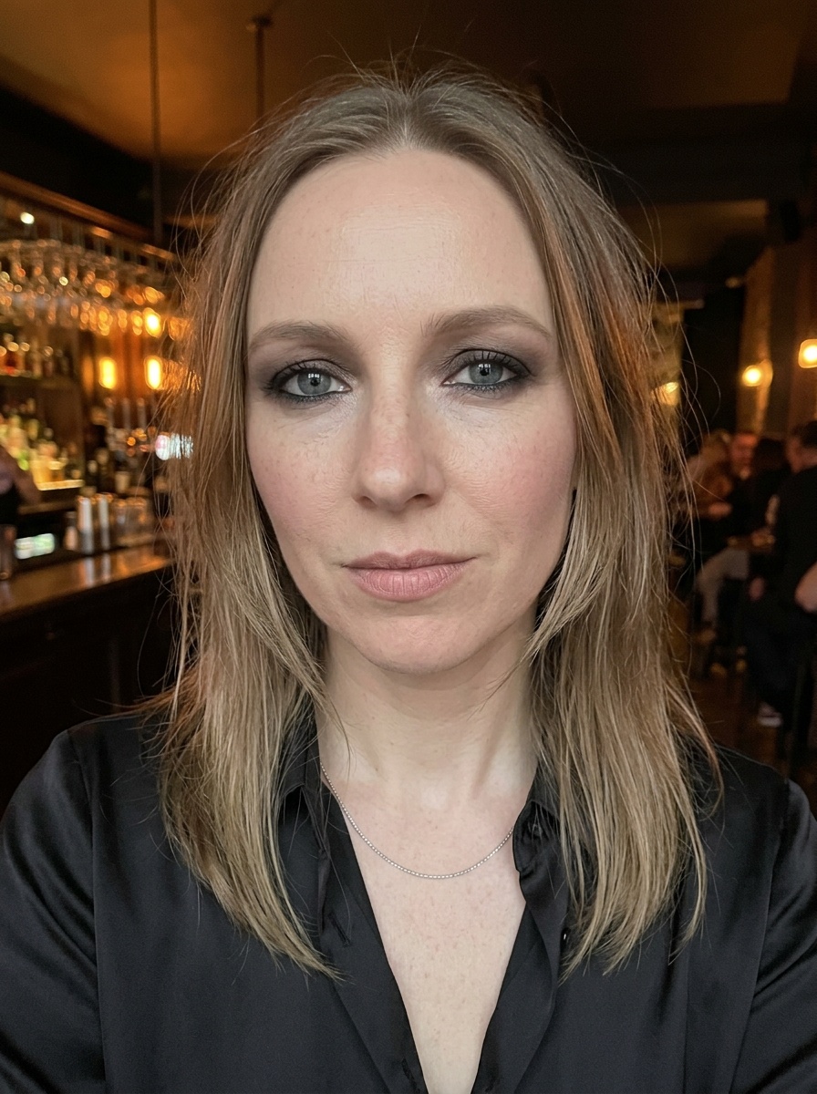 Classic Smokey Eye on a woman in her early 30s with fair skin and hooded blue eyes