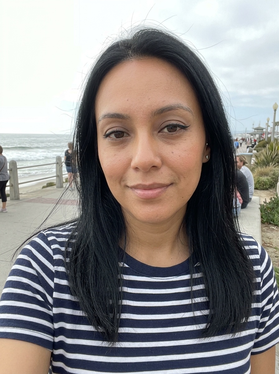 Winged Eyeliner on a woman in her early 30s with tan skin and downturned brown eyes