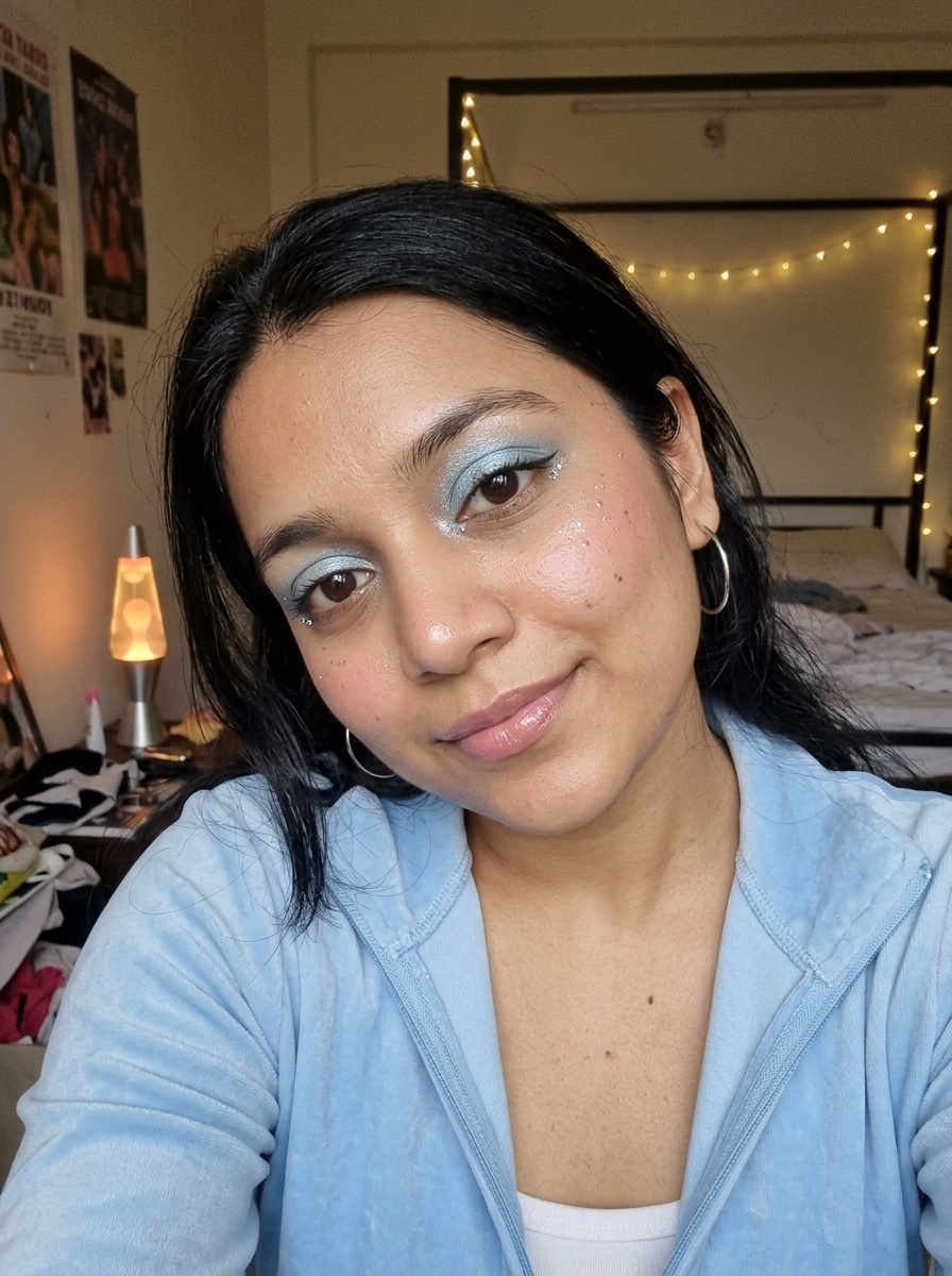 Y2K Makeup on a woman in her early 20s with medium skin, brown eyes and a round face